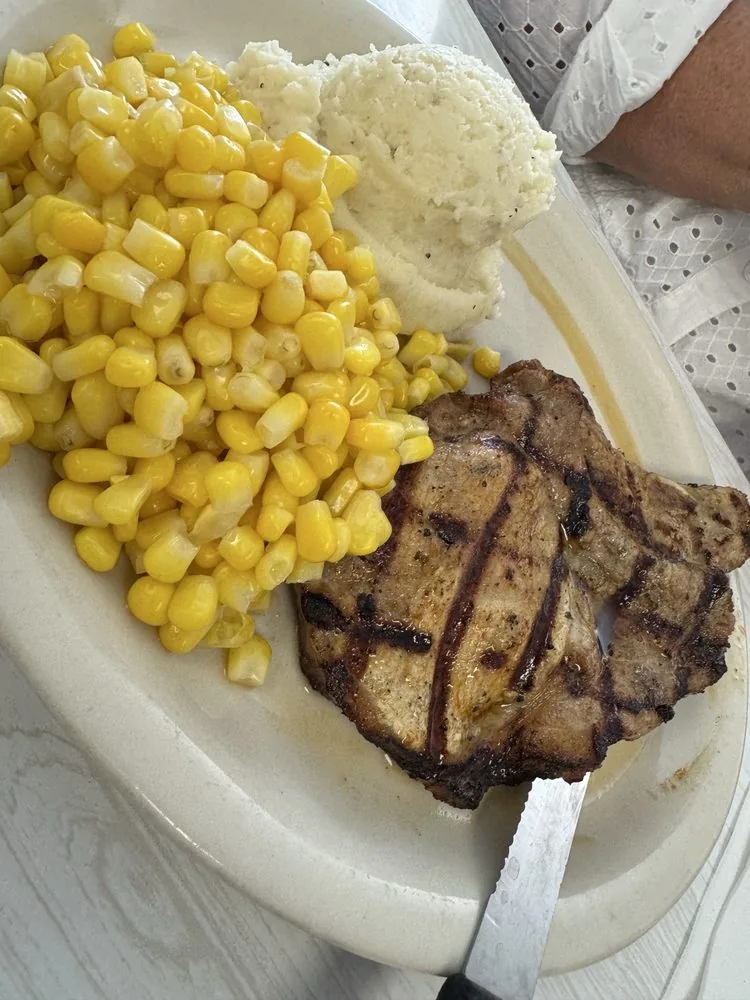 Center cut pork chop plate with sides at City Cafe in South Houston