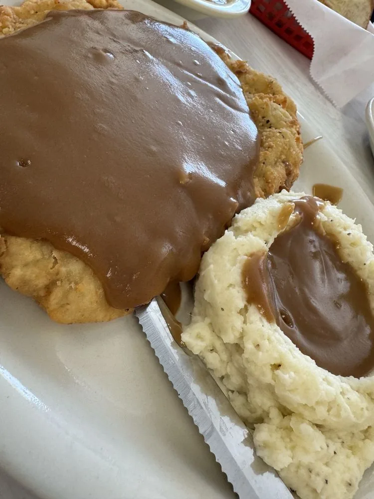 Chicken-fried steak with brown gravy and sides at City Cafe in South Houston
