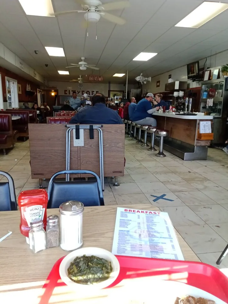 The dining room at City Cafe in South Houston with tables set for breakfast service