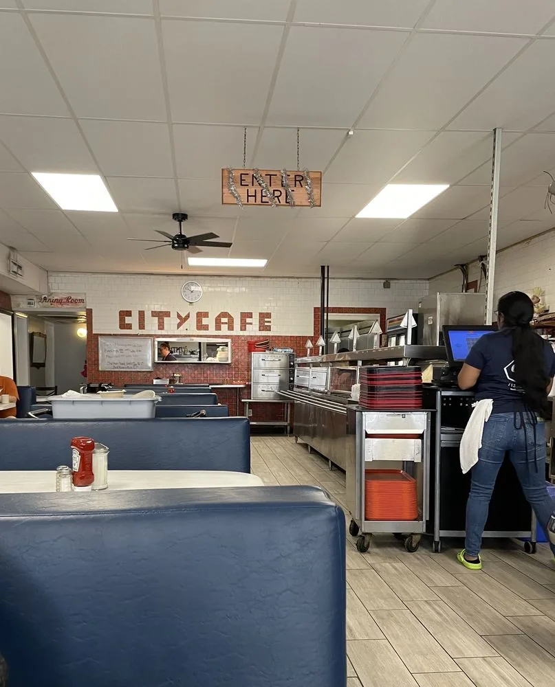 View across the steam table toward the dining area at City Cafe in South Houston