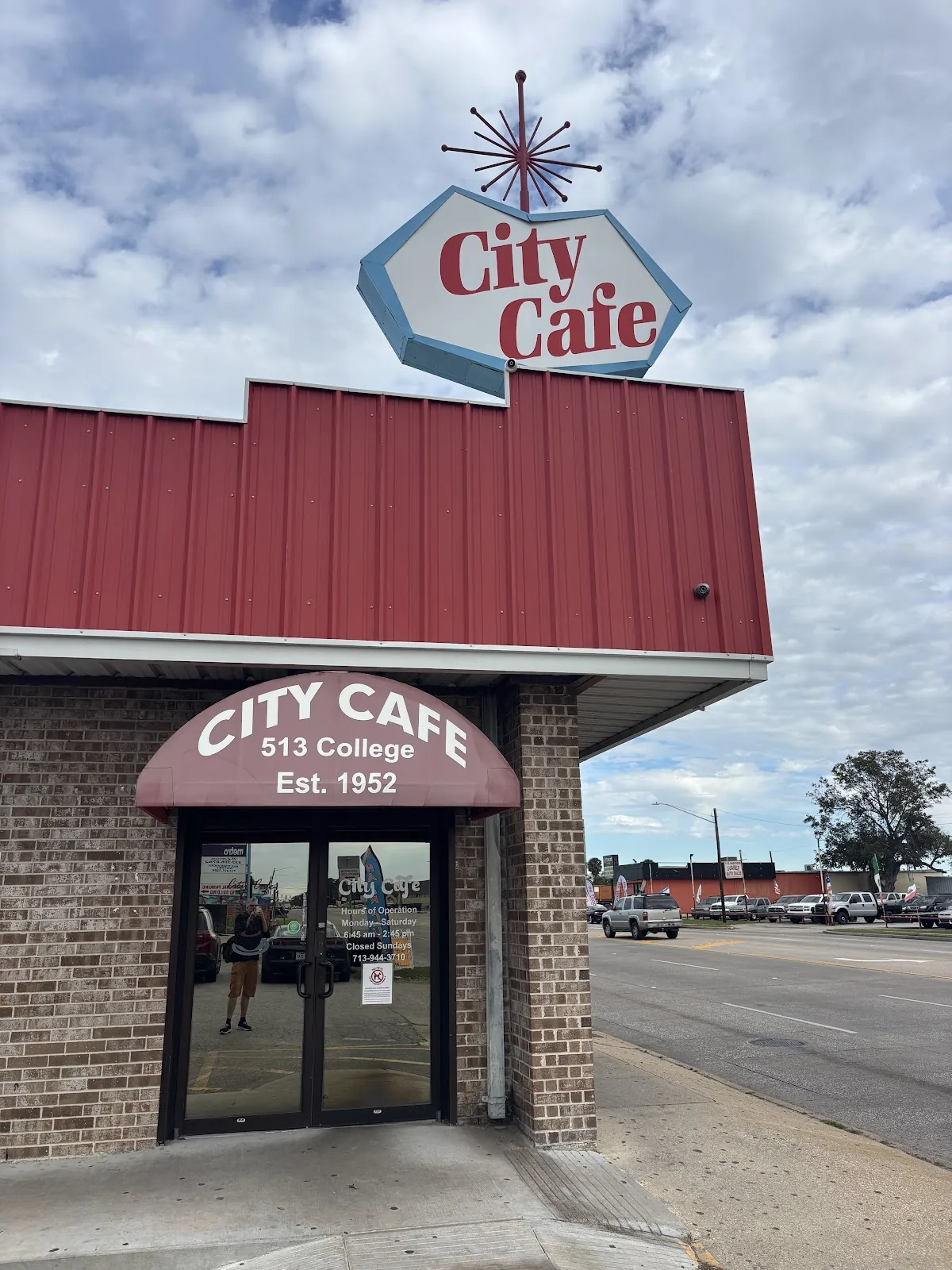 The City Cafe roadside sign above the red brick building at 513 College Ave in South Houston, Texas